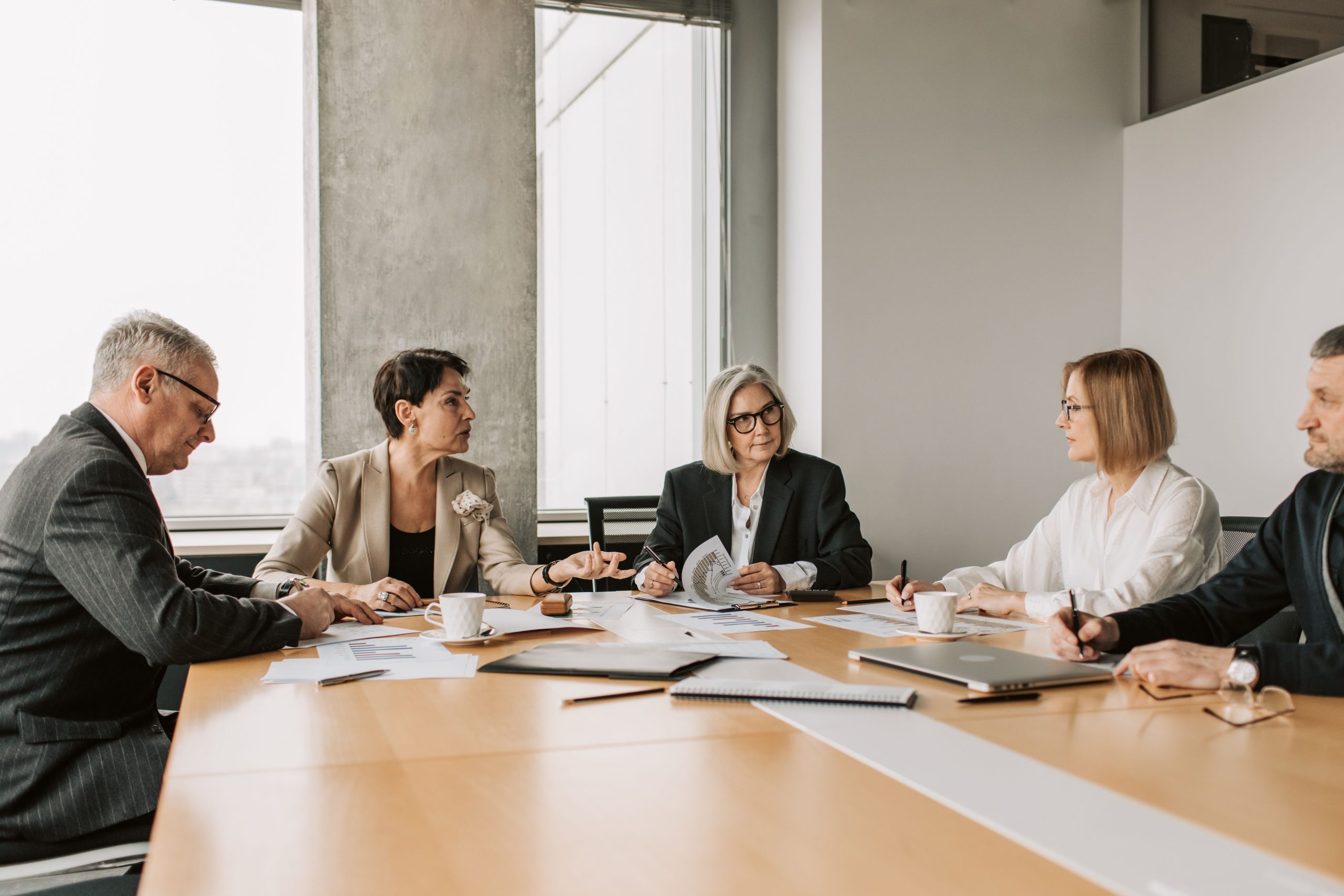 Nonprofit board reviewing financial reports and organizational finances